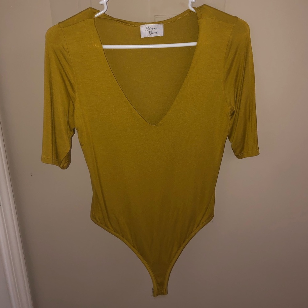 Mustard color body suit!